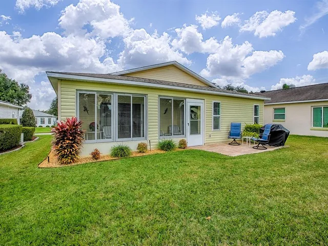 a view of a house with swimming pool and porch