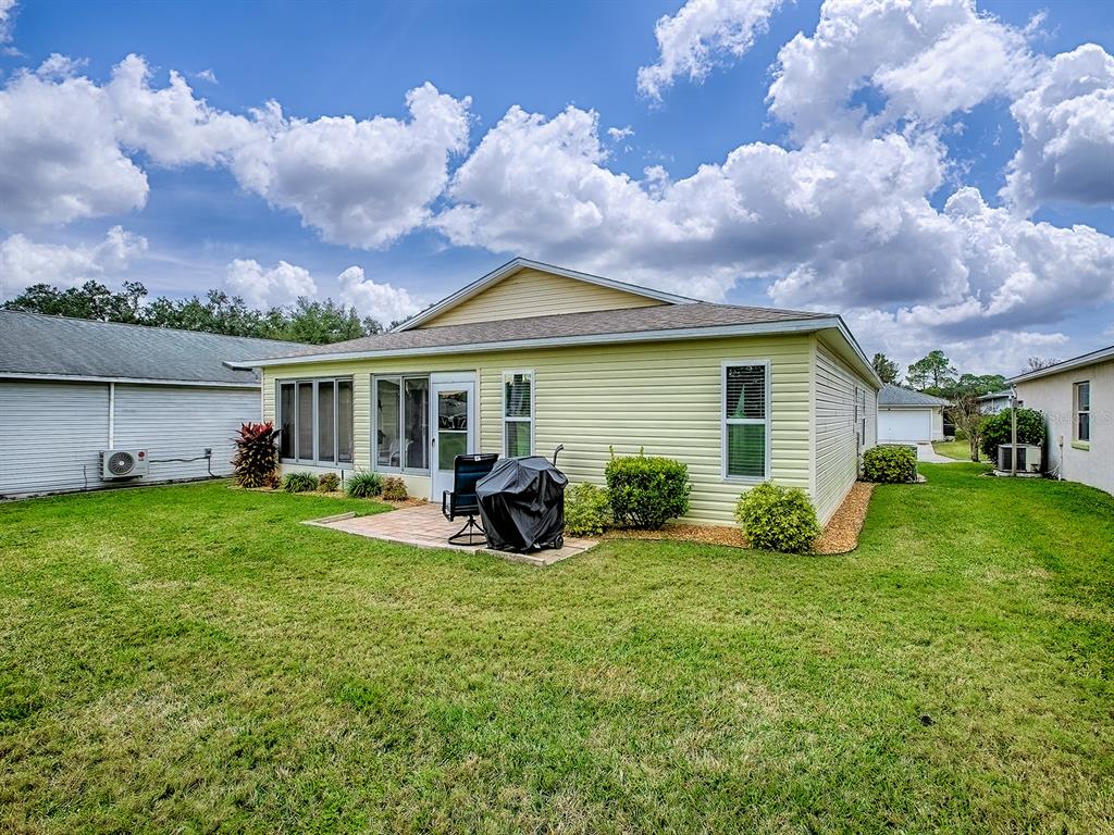 634 Timbercrest Drive Leesburg, FL 34748 - Photo 5 of 38 a view of house with backyard