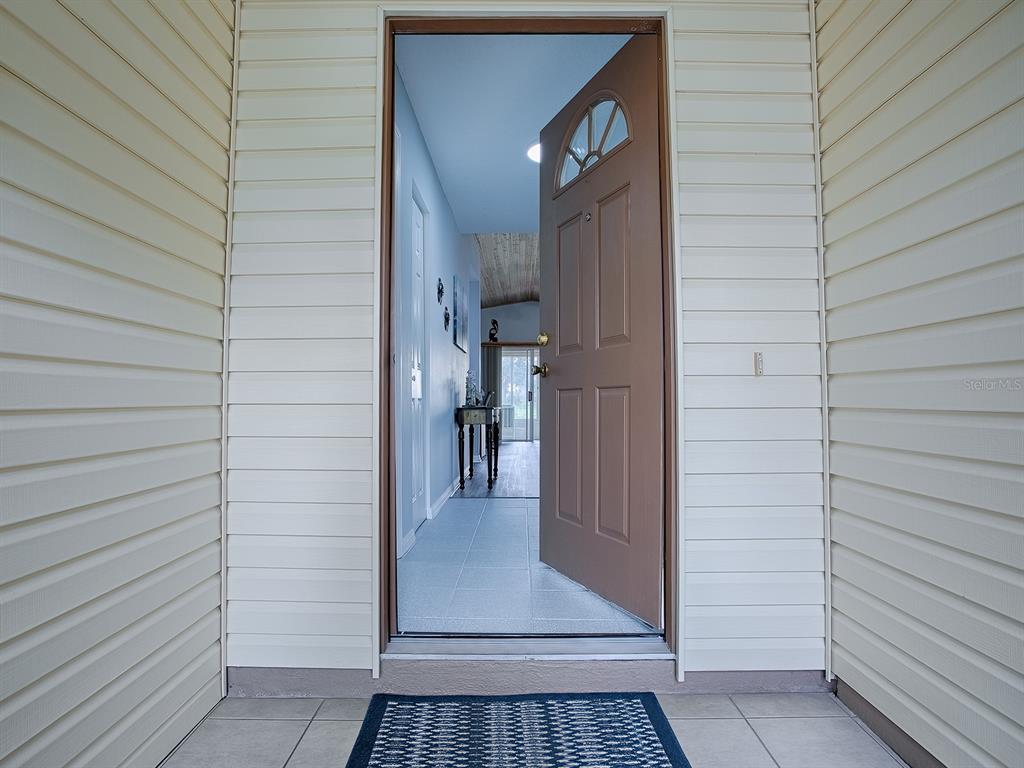 634 Timbercrest Drive Leesburg, FL 34748 - Photo 6 of 38 a view of a door and an outdoor space