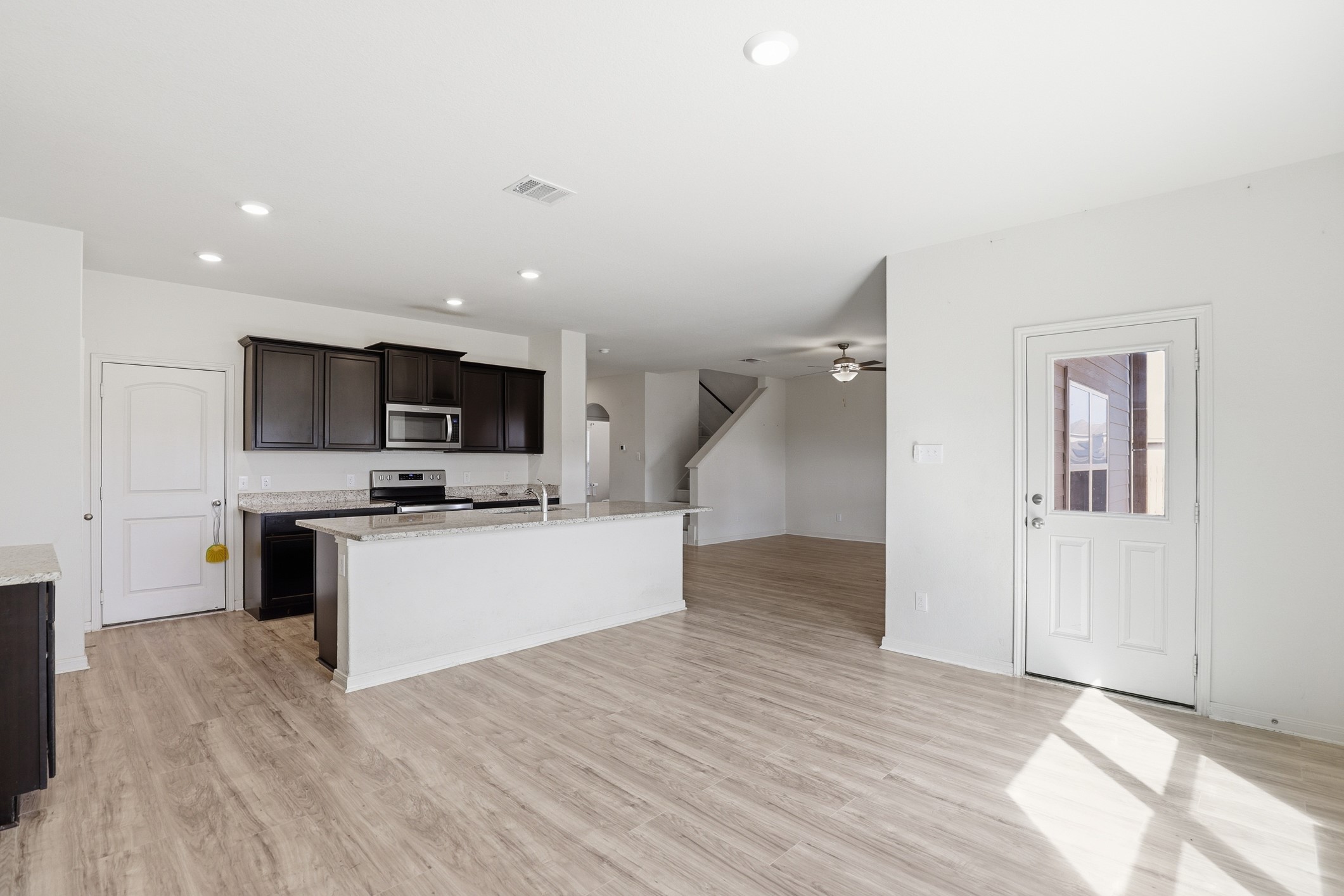 300 Hyacinth Way Jarrell, TX 76537 - Photo 12 of 30 a view of kitchen with microwave oven stove and white cabinets