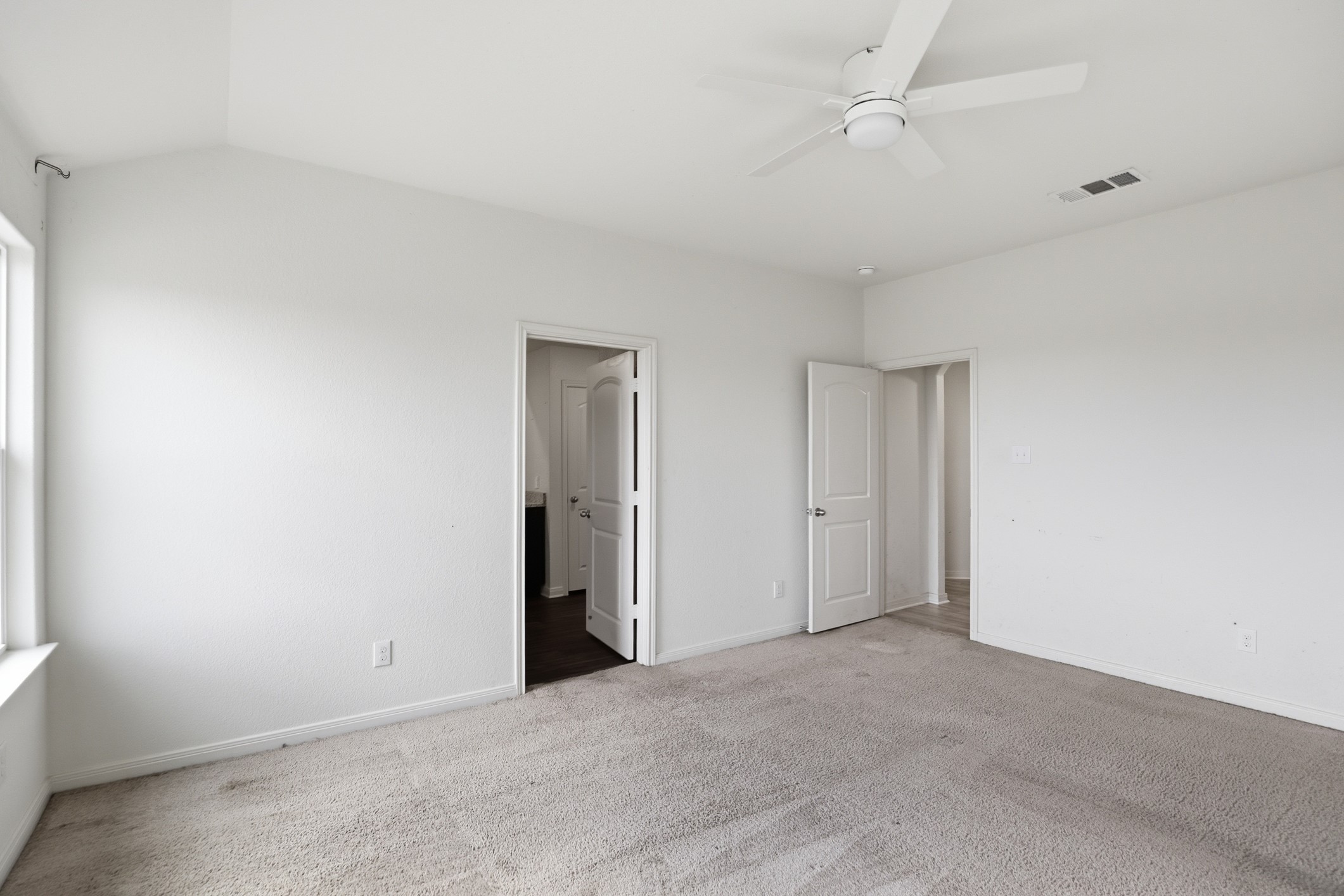 300 Hyacinth Way Jarrell, TX 76537 - Photo 18 of 30 an empty room with closet and a ceiling fan