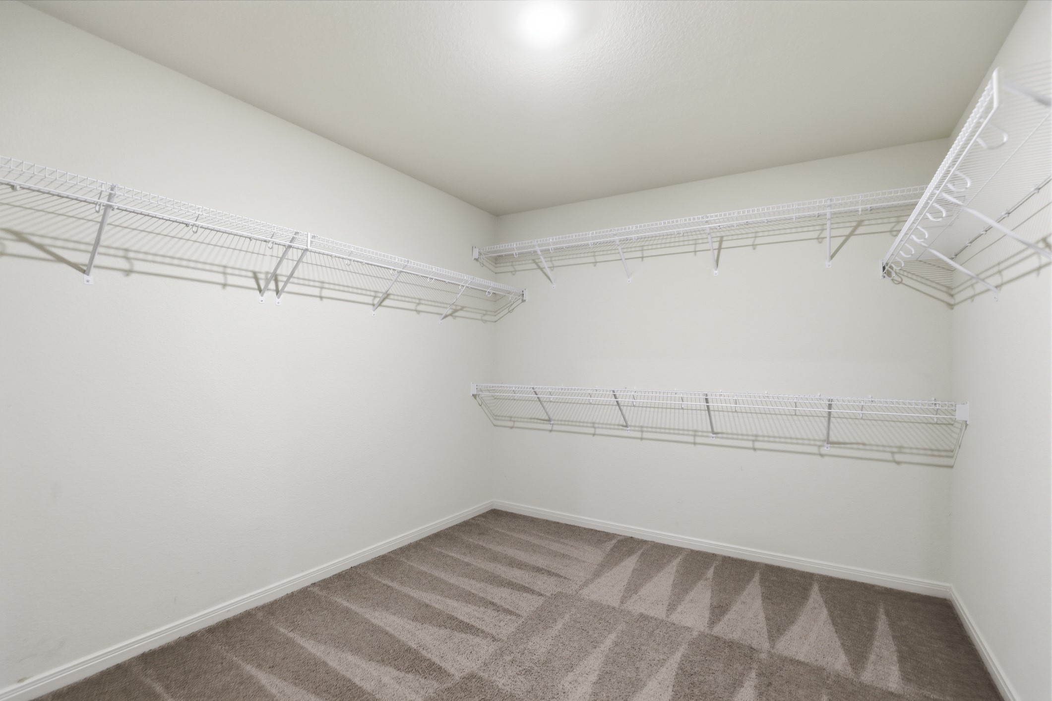 300 Hyacinth Way Jarrell, TX 76537 - Photo 22 of 30 a view of a room with racks on the wall