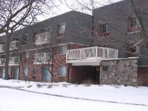 918 Ridge Square, Unit 213 Elk Grove Village, IL 60007 - Photo 1 of 1 a front view of a house with a yard