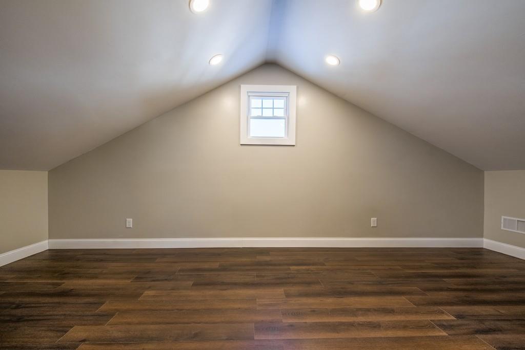 21 Old Point Street Springfield, MA 01109 - Photo 20 of 32 a view of an empty room with wooden floor and a window