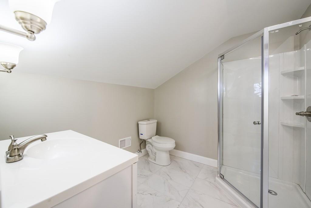 21 Old Point Street Springfield, MA 01109 - Photo 23 of 32 a bathroom with a sink a toilet and shower