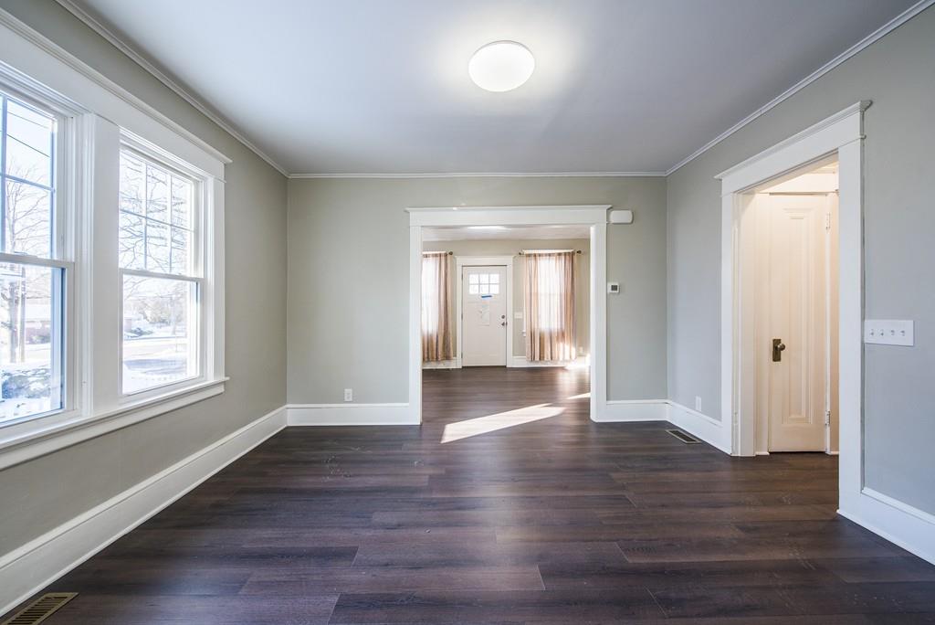 21 Old Point Street Springfield, MA 01109 - Photo 8 of 32 a view of empty room with wooden floor and fan