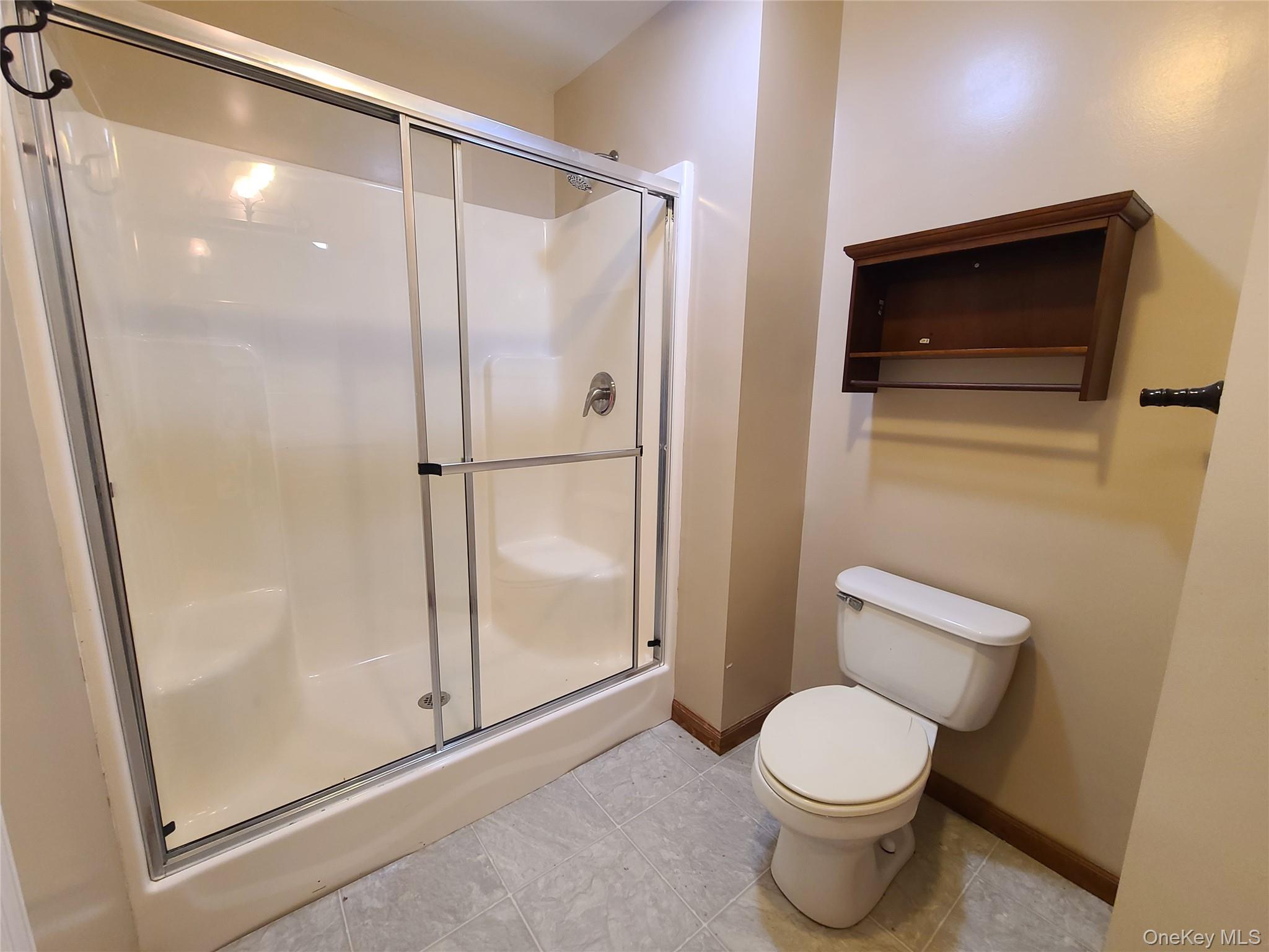 82 Benton Hollow Road Liberty, NY 12754 - Photo 16 of 36 a bathroom with a toilet and a shower