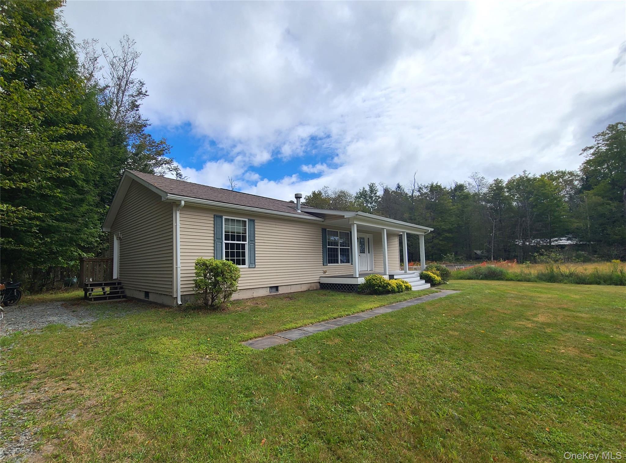 82 Benton Hollow Road Liberty, NY 12754 - Photo 2 of 36 a view of a house with a yard and sitting area