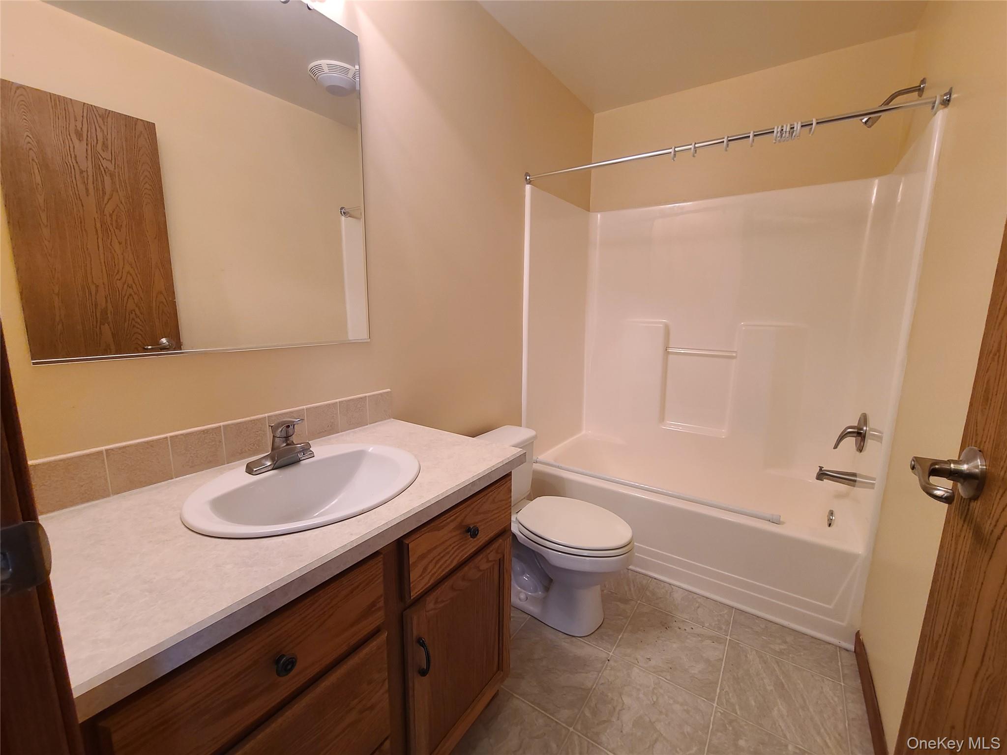 82 Benton Hollow Road Liberty, NY 12754 - Photo 21 of 36 a bathroom with a sink a toilet and shower