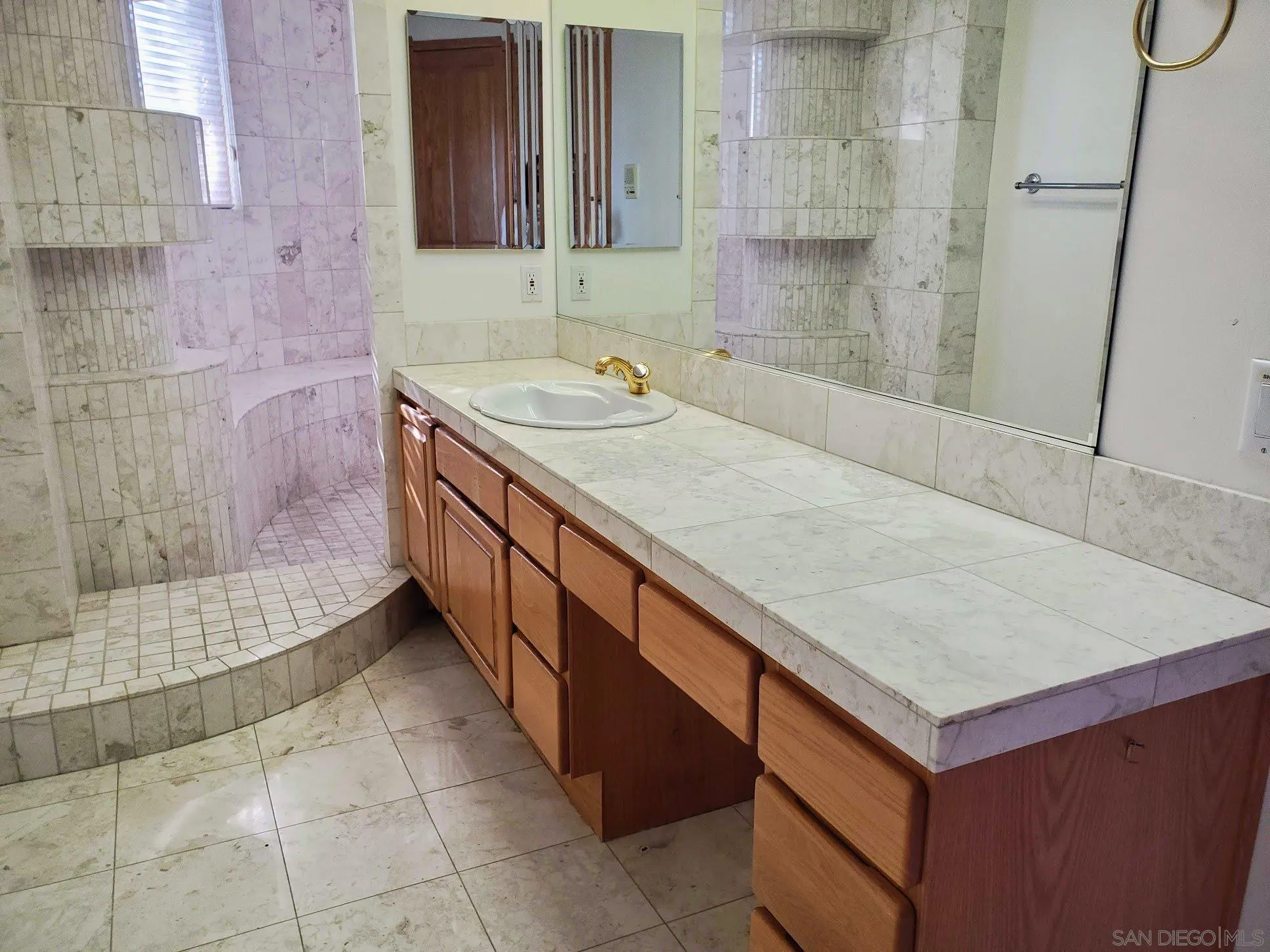 14316 Twisted Branch Road Poway, CA 92064 - Photo 17 of 36 a bathroom with a sink and a mirror