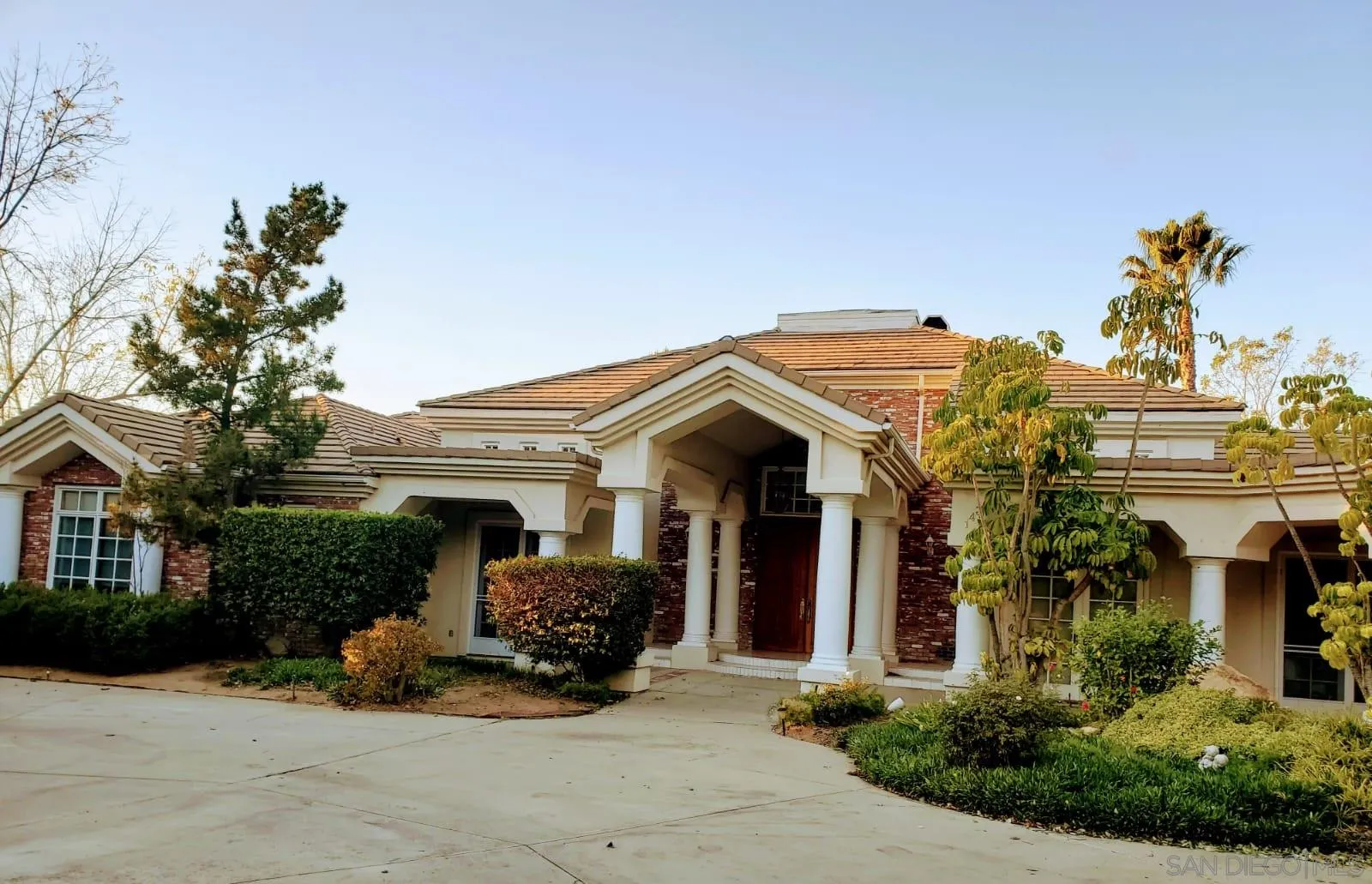 14316 Twisted Branch Road Poway, CA 92064 - Photo 2 of 36 a view of a house with potted plants and a garage