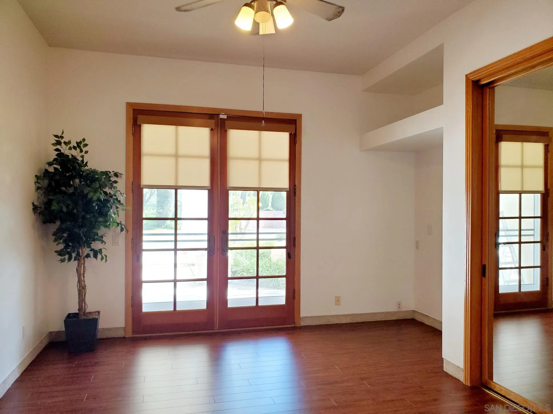 14316 Twisted Branch Road Poway, CA 92064 - Photo 23 of 36 an empty room with wooden floor and a window