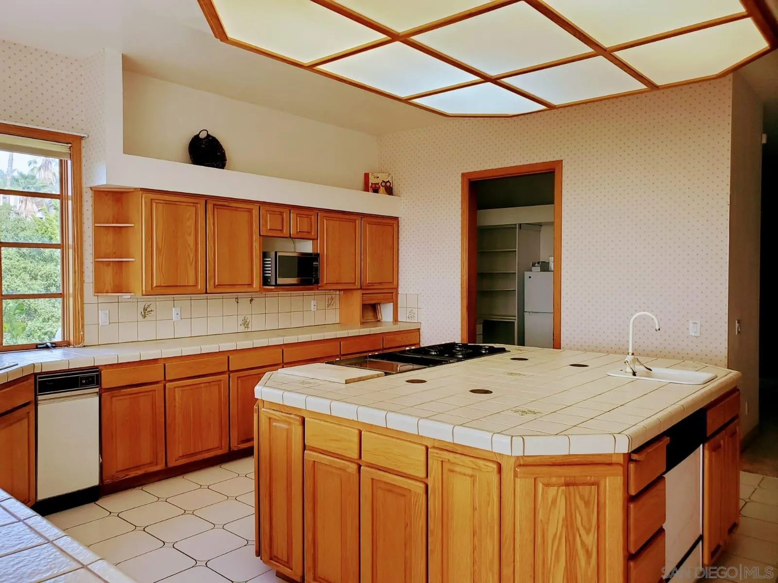 14316 Twisted Branch Road Poway, CA 92064 - Photo 29 of 36 a kitchen with a sink and a stove top oven