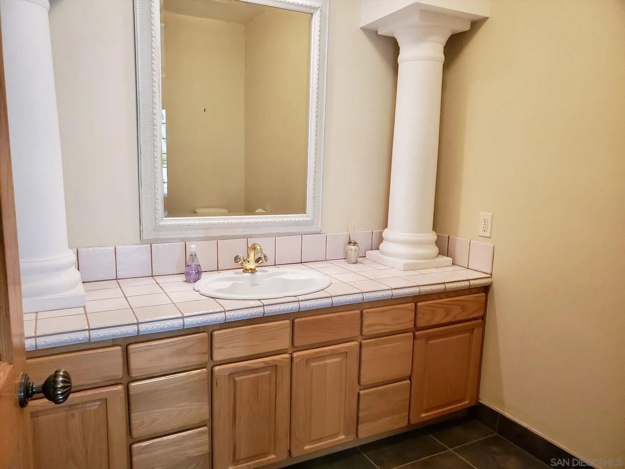 14316 Twisted Branch Road Poway, CA 92064 - Photo 31 of 36 a bathroom with a sink and a mirror