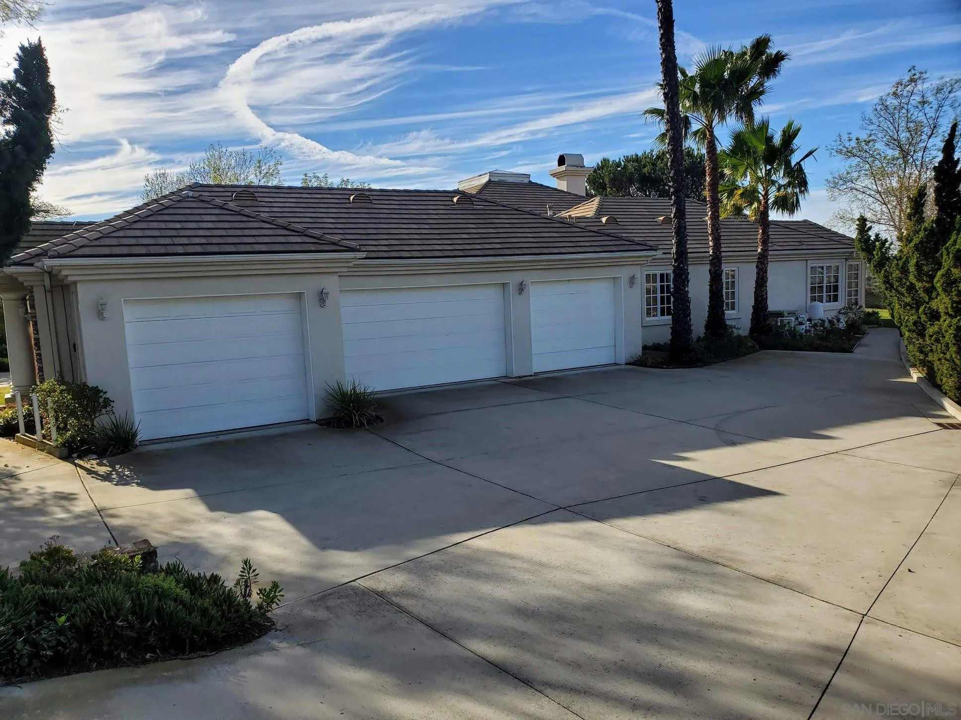 14316 Twisted Branch Road Poway, CA 92064 - Photo 33 of 36 a front view of a house with a yard and garage