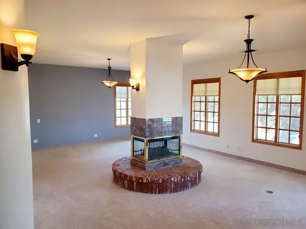 14316 Twisted Branch Road Poway, CA 92064 - Photo 36 of 36 a living room with furniture and a chandelier