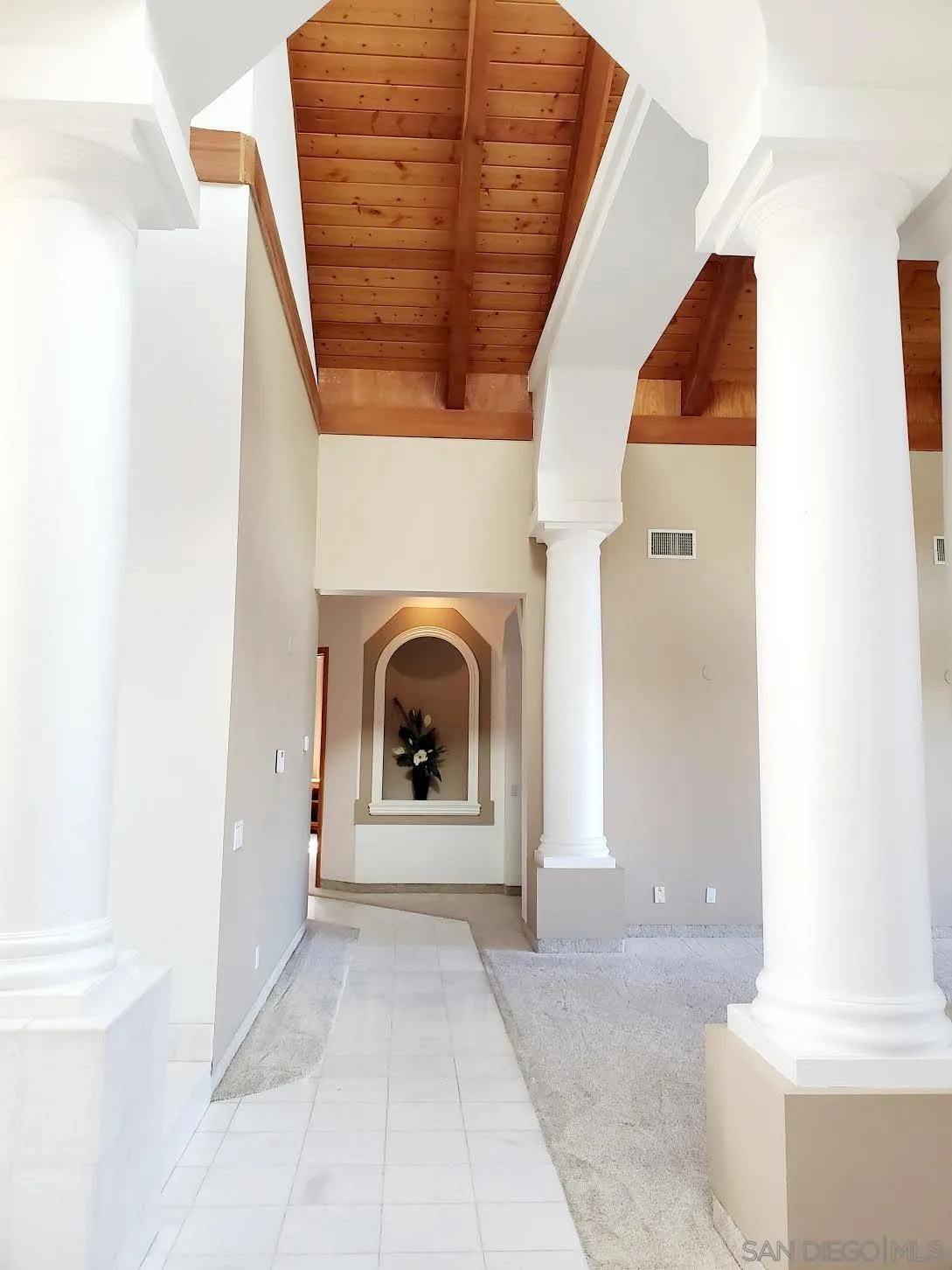 14316 Twisted Branch Road Poway, CA 92064 - Photo 8 of 36 a view of a hallway with washer and dryer