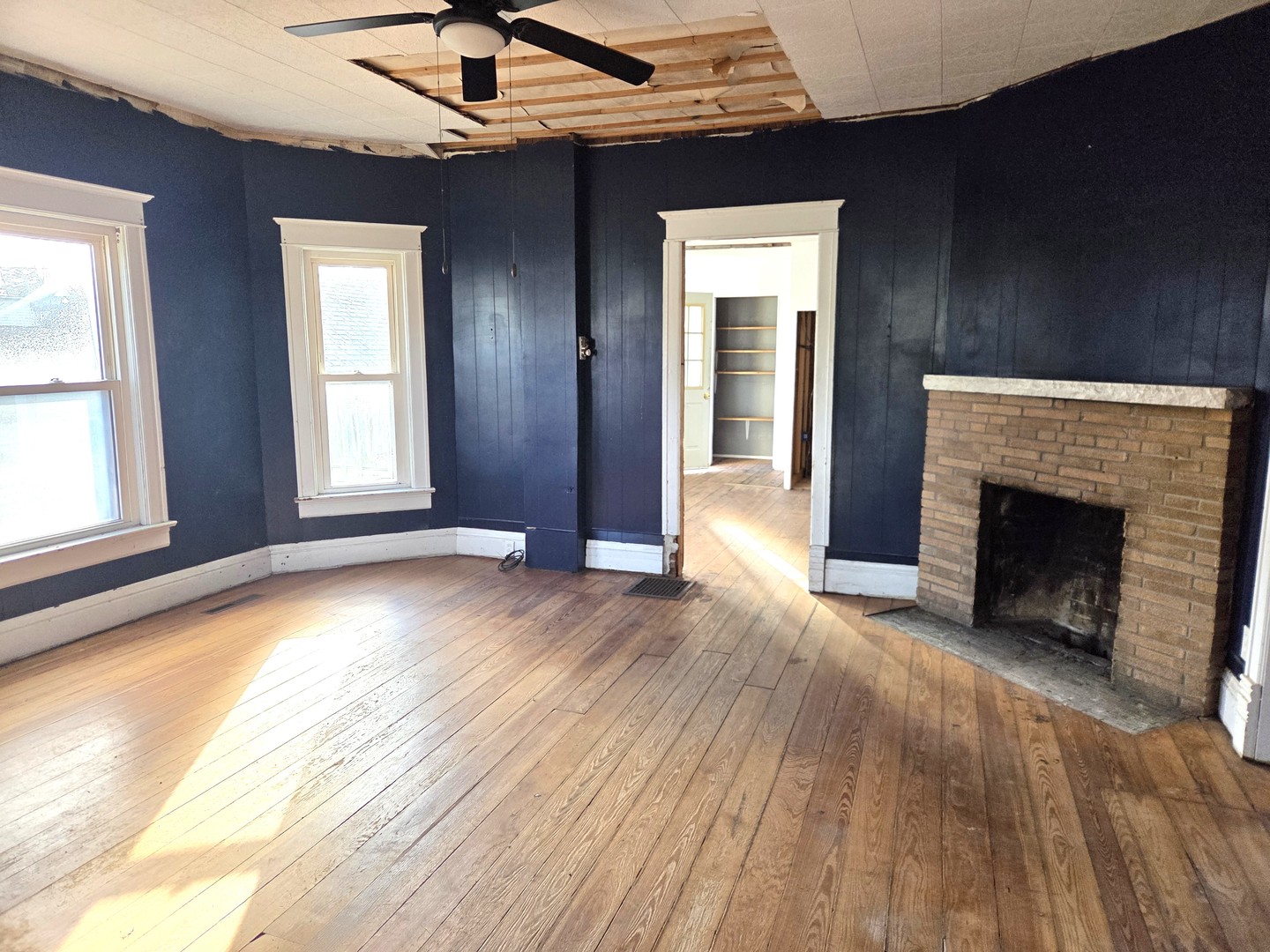290 West Kankakee Avenue Herscher, IL 60941 - Photo 5 of 13 a view of an empty room with exposed radiator and fireplace