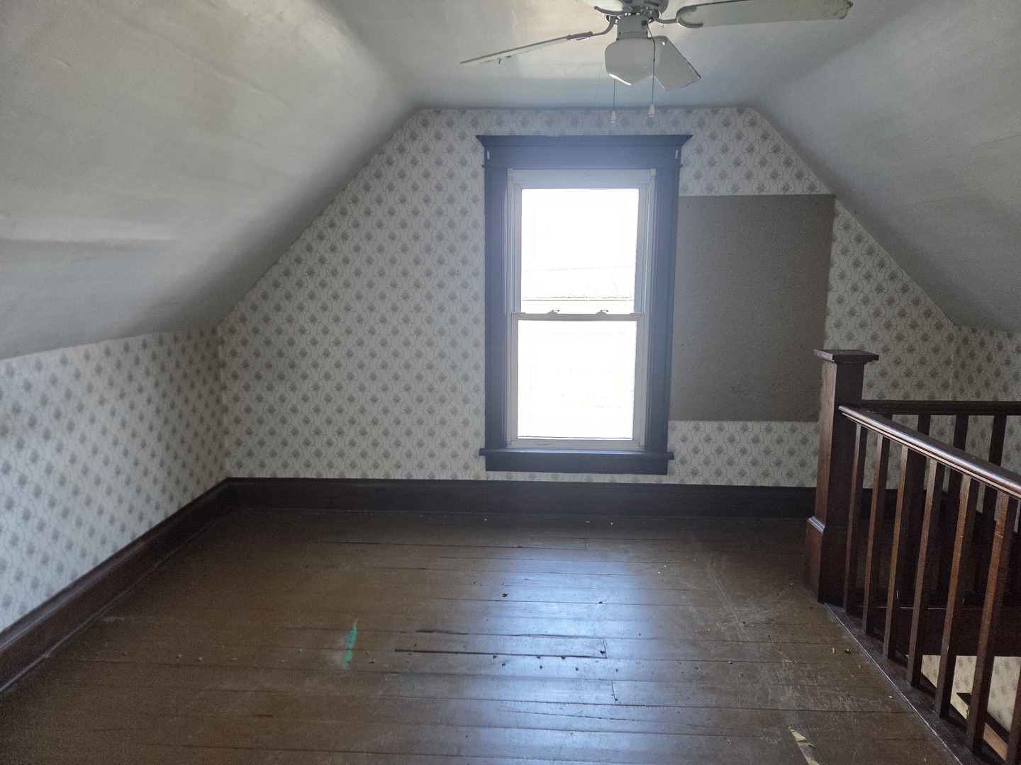290 West Kankakee Avenue Herscher, IL 60941 - Photo 10 of 13 an empty room with wooden floor and windows