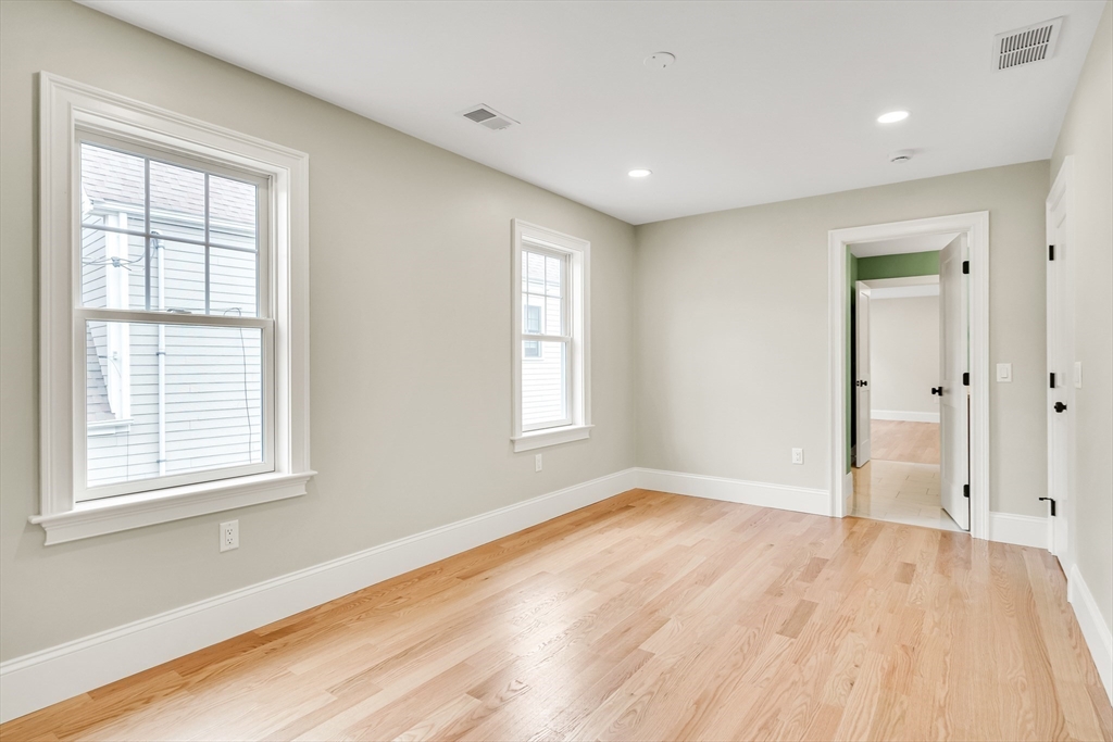 232 Lincoln Street Lexington, MA 02421 - Photo 31 of 41 a view of empty room with wooden floor and fan