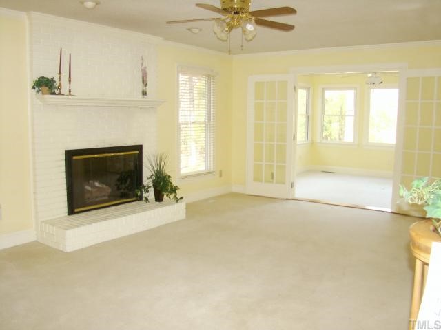 3409 Greenville Loop Road Wake Forest, NC 27587 - Photo 2 of 12 a view of an empty room with a fireplace