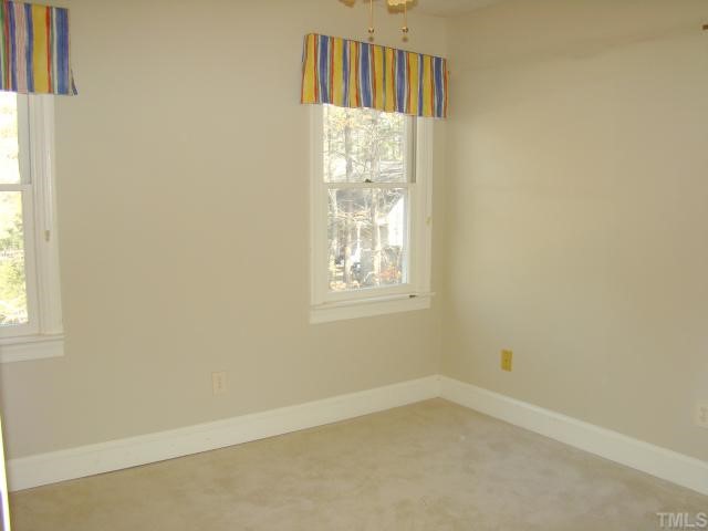 3409 Greenville Loop Road Wake Forest, NC 27587 - Photo 10 of 12 an empty room with windows