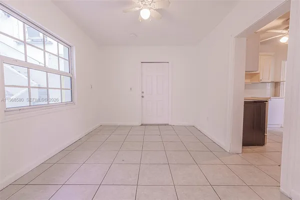 a view of an empty room with a window
