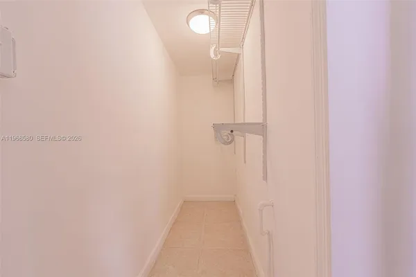 a view of a bathroom from a hallway