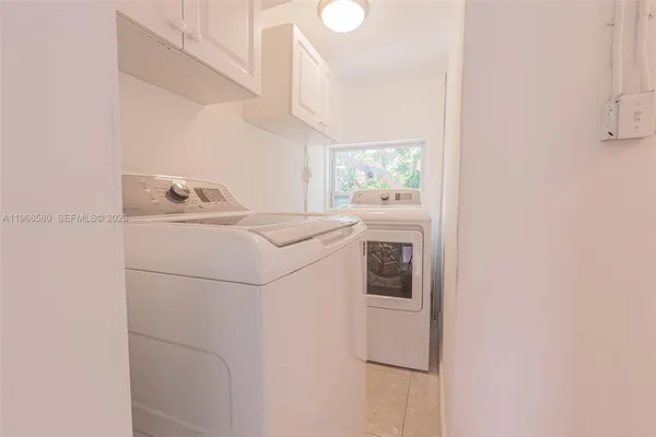a utility room with dryer and washer