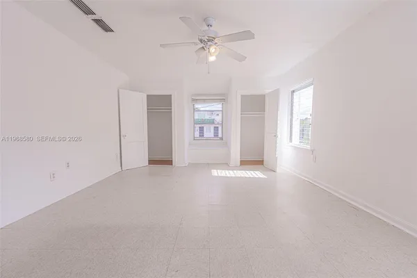 a view of an empty room with a window