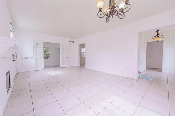 a view of an empty room with a window