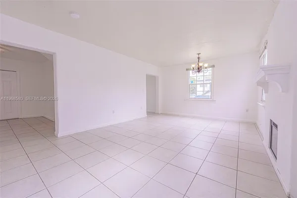 a view of an empty room with a window