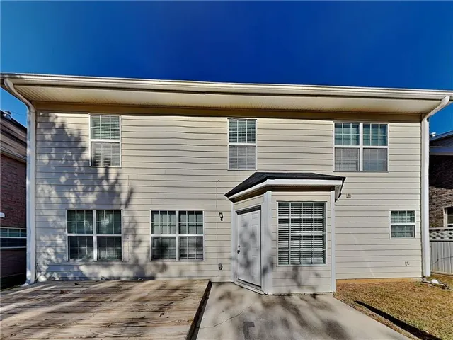 a view of a house with a door and wooden floor