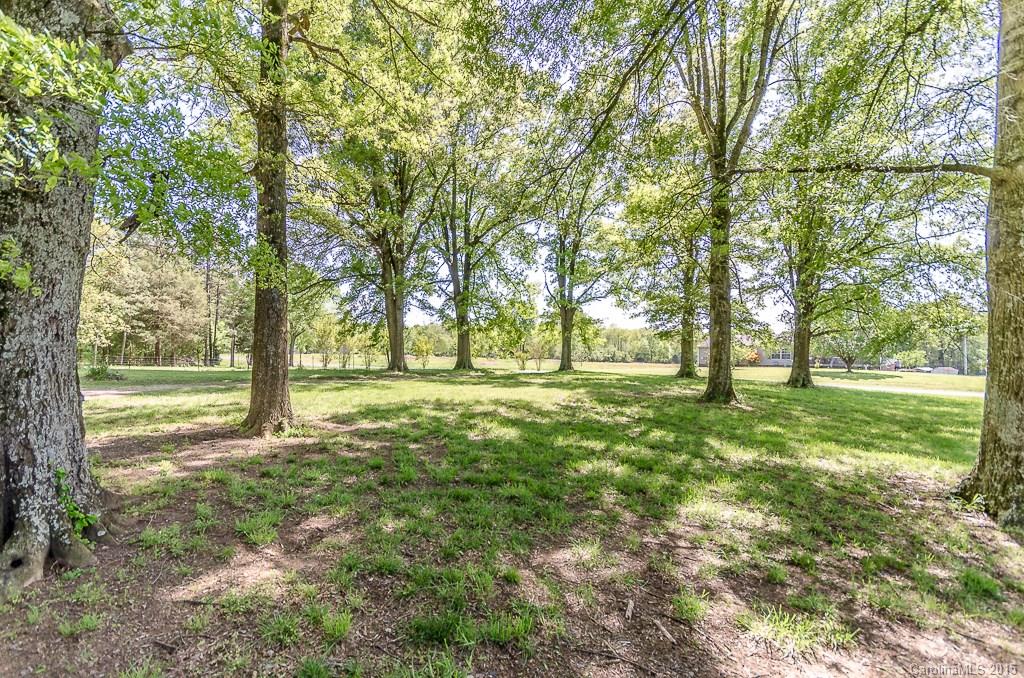 4401 Austin Road Monroe, NC 28112 - Photo 2 of 22 a view of outdoor space with trees all around