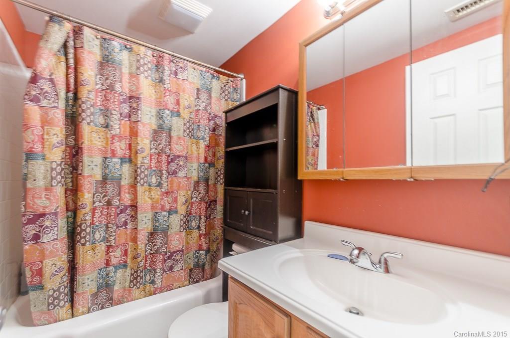 4401 Austin Road Monroe, NC 28112 - Photo 11 of 22 a bathroom with a sink and a mirror