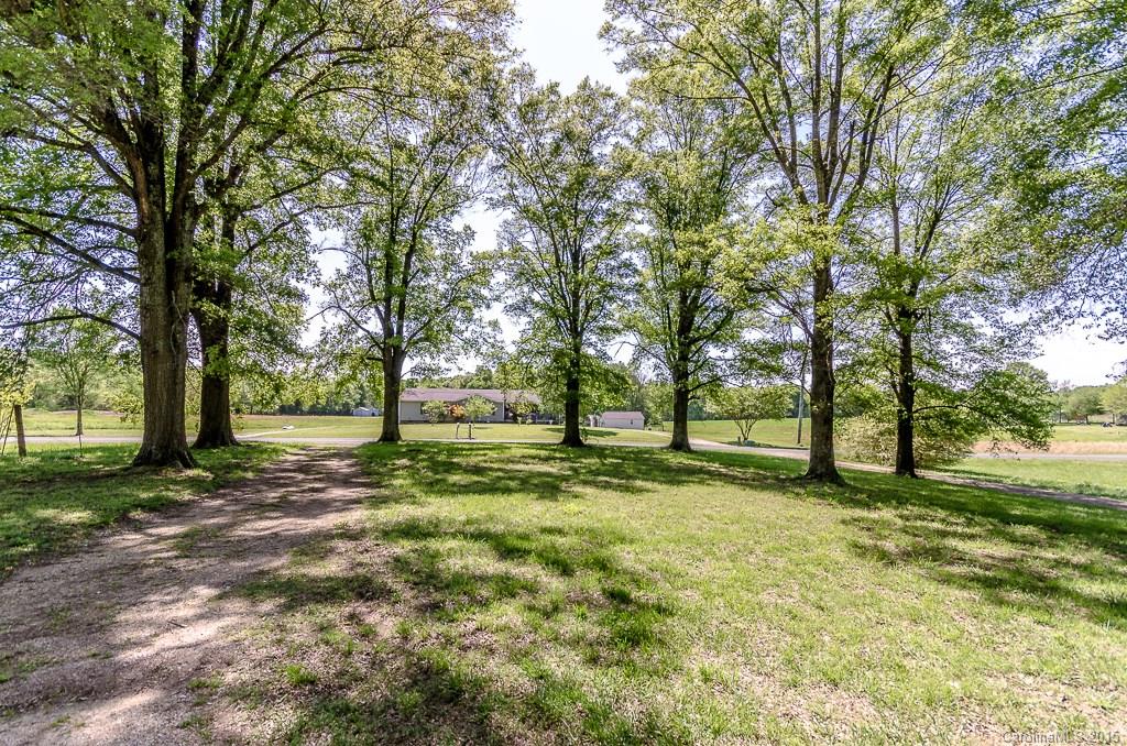 4401 Austin Road Monroe, NC 28112 - Photo 3 of 22 a view of a yard with a tree