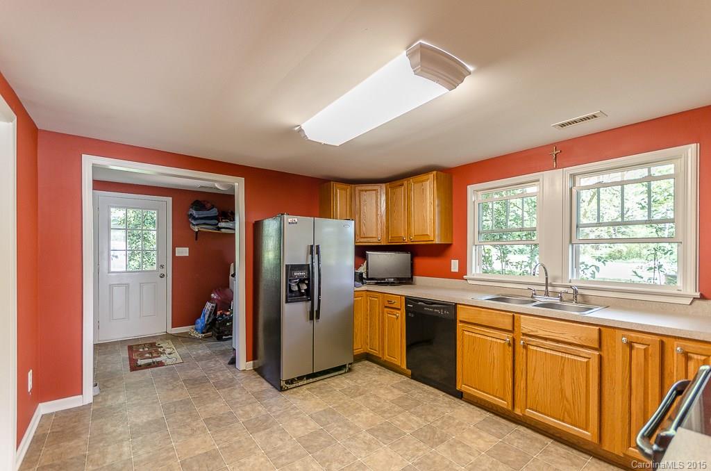 4401 Austin Road Monroe, NC 28112 - Photo 7 of 22 a view of a kitchen with a sink refrigerator and window