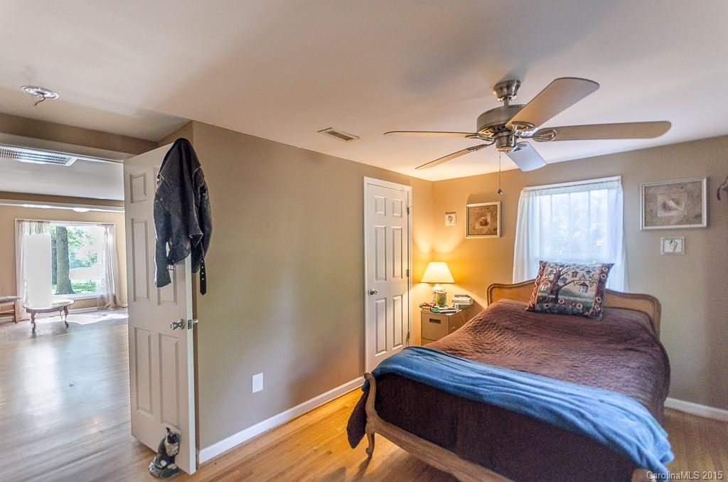4401 Austin Road Monroe, NC 28112 - Photo 10 of 22 a bedroom with a bed and wooden floor