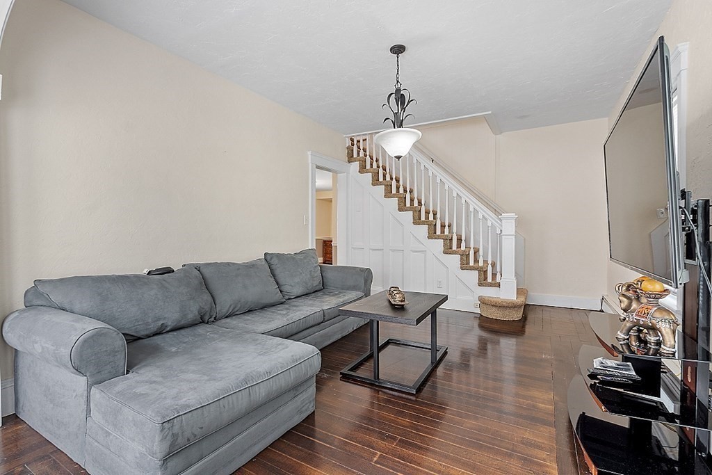 86 Upper Gore Road Webster, MA 01570 - Photo 30 of 42 a living room with furniture and a chandelier