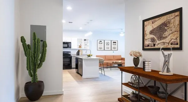 a view of a workspace with furniture and a potted plant