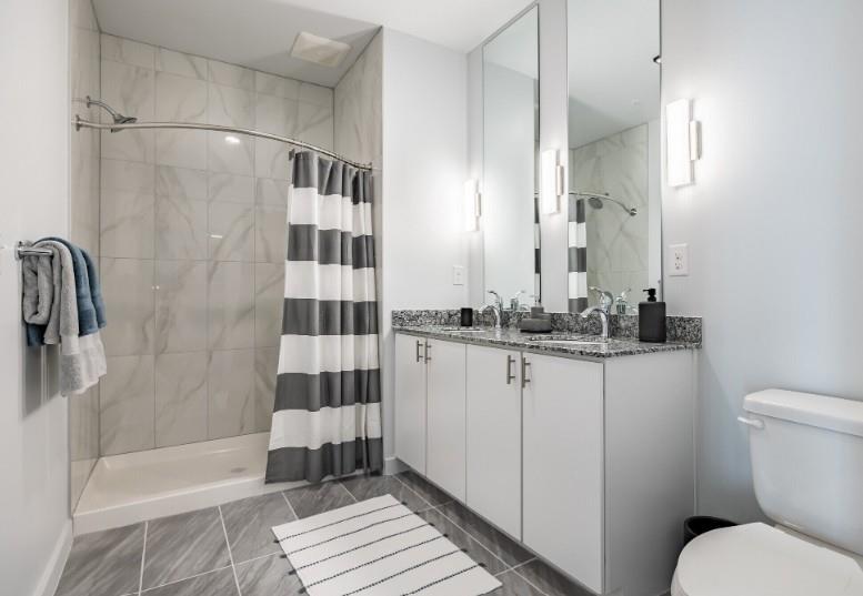 750 Avondale Creek Dr., Unit 206 Decatur, GA 30032 - Photo 21 of 35 a bathroom with a sink toilet and shower
