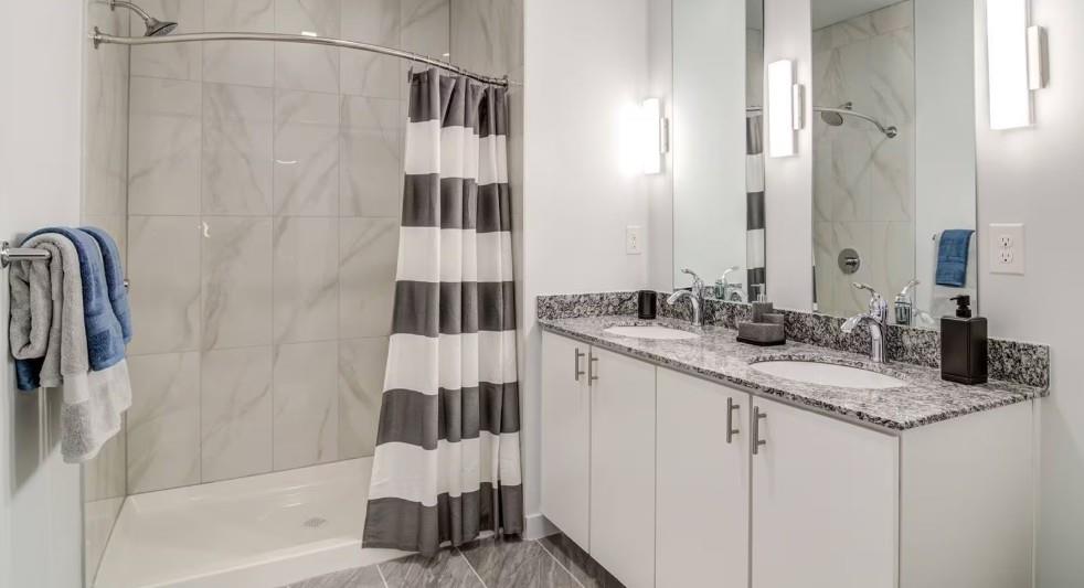 750 Avondale Creek Dr., Unit 206 Decatur, GA 30032 - Photo 25 of 35 a bathroom with a sink and a mirror