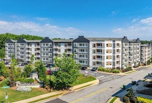 750 Avondale Creek Dr., Unit 206 Decatur, GA 30032 - Photo 29 of 35 a front view of a building with a garden and plants