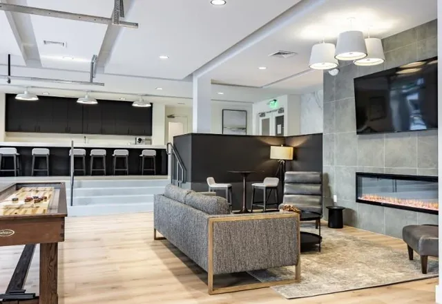 a room with gym equipment and mirrors