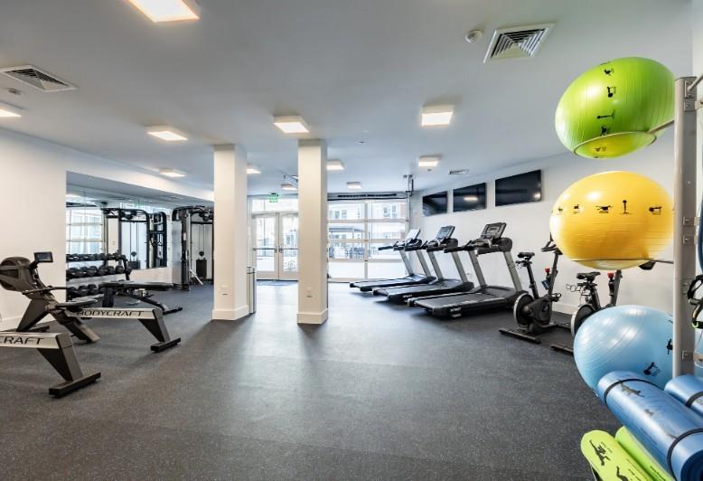 750 Avondale Creek Dr., Unit 206 Decatur, GA 30032 - Photo 32 of 35 a room with gym equipment and mirrors