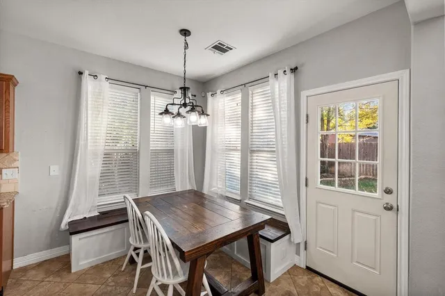 a bedroom with a large bed and a flat screen tv