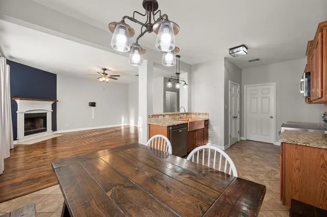 a bathroom with a sink a large mirror and a shower