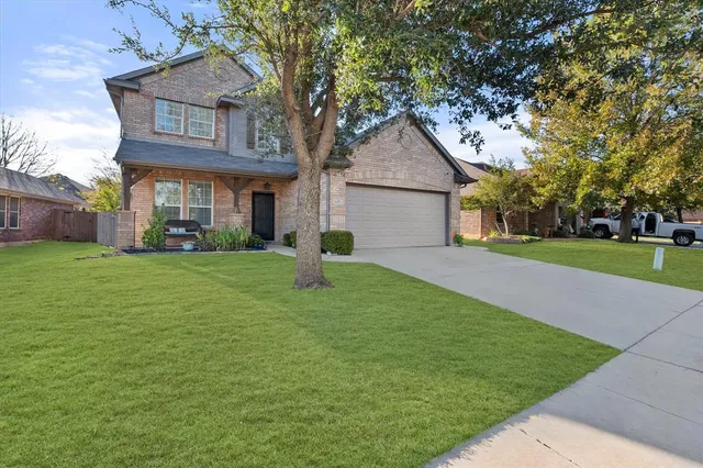 a living room with dining room and wooden floor