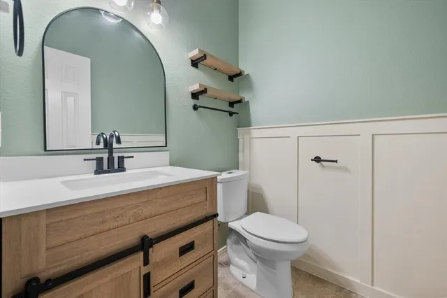 an aerial view of multiple houses with yard