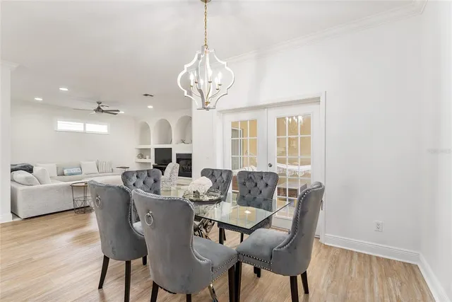 a large kitchen with a table and chairs